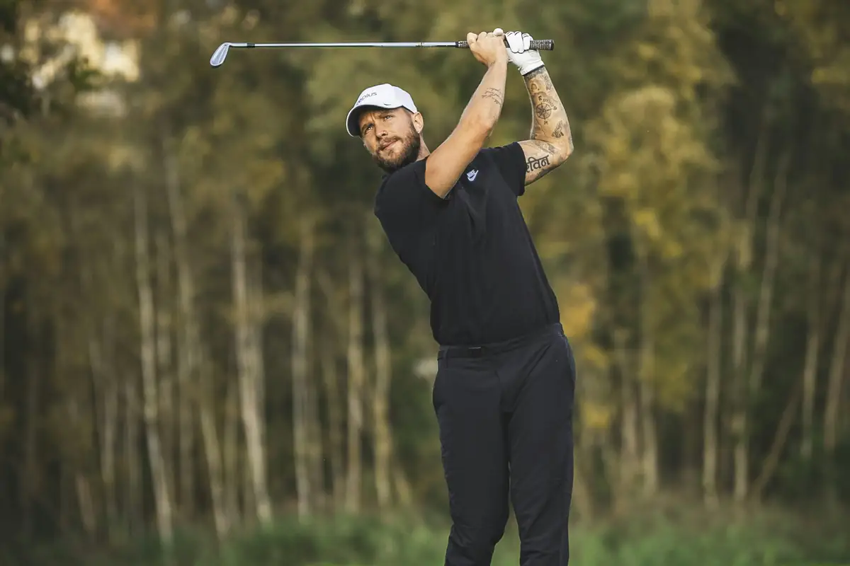 A golfer mid-swing